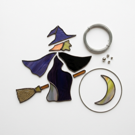 AI-generated illustrative concept of an unassembled witch stained-glass suncatcher kit; actual pieces and contents may differ
